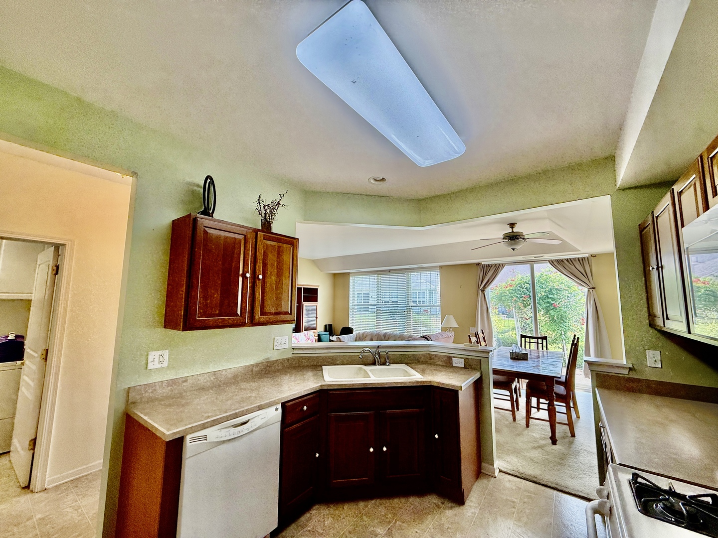 13455 Nealy Road Huntley, IL 60142 - Photo 8 of 16 a kitchen with a sink a counter top space and stainless steel appliances