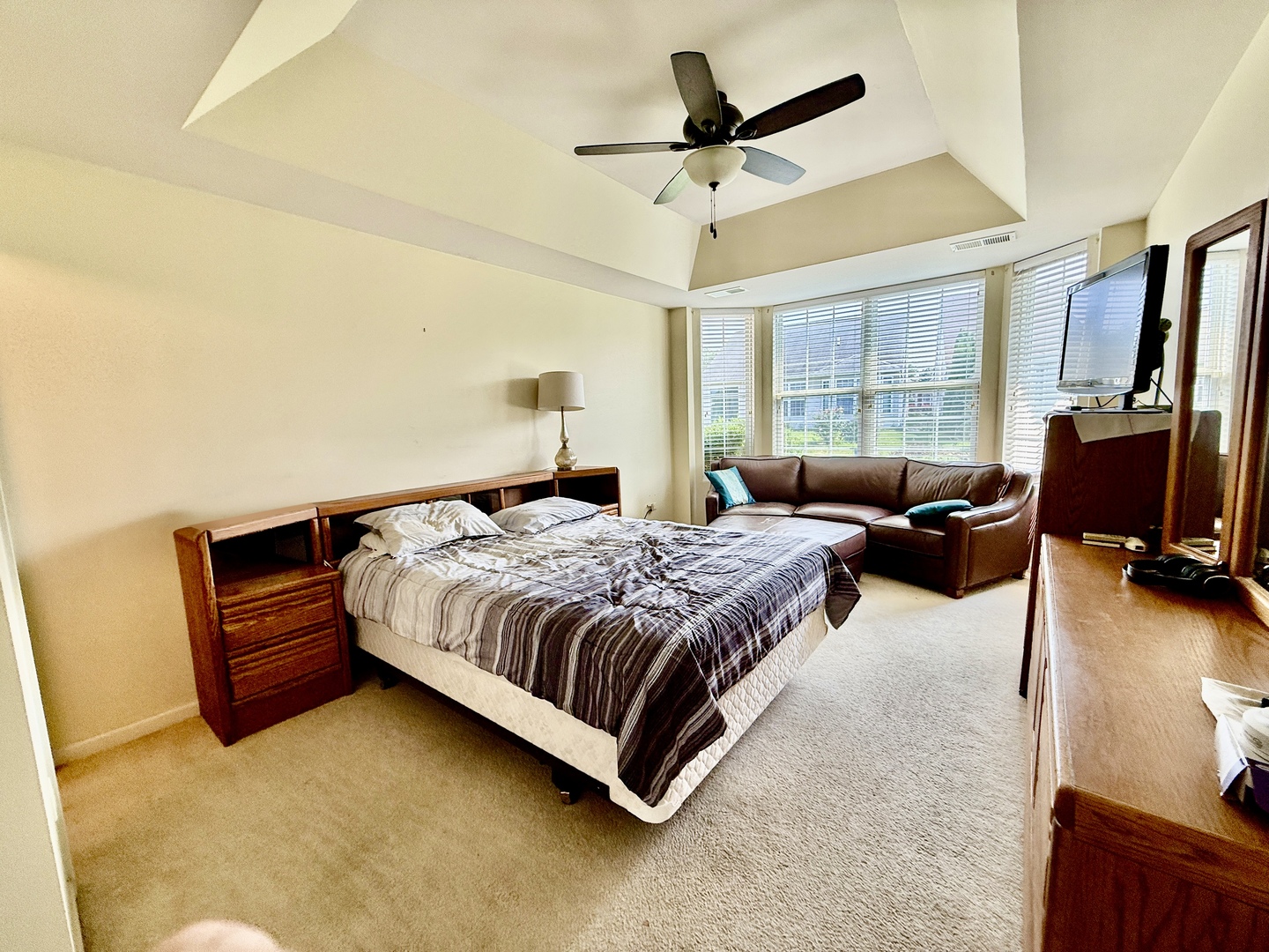 13455 Nealy Road Huntley, IL 60142 - Photo 10 of 16 a bedroom with a bed flat screen tv and a large window