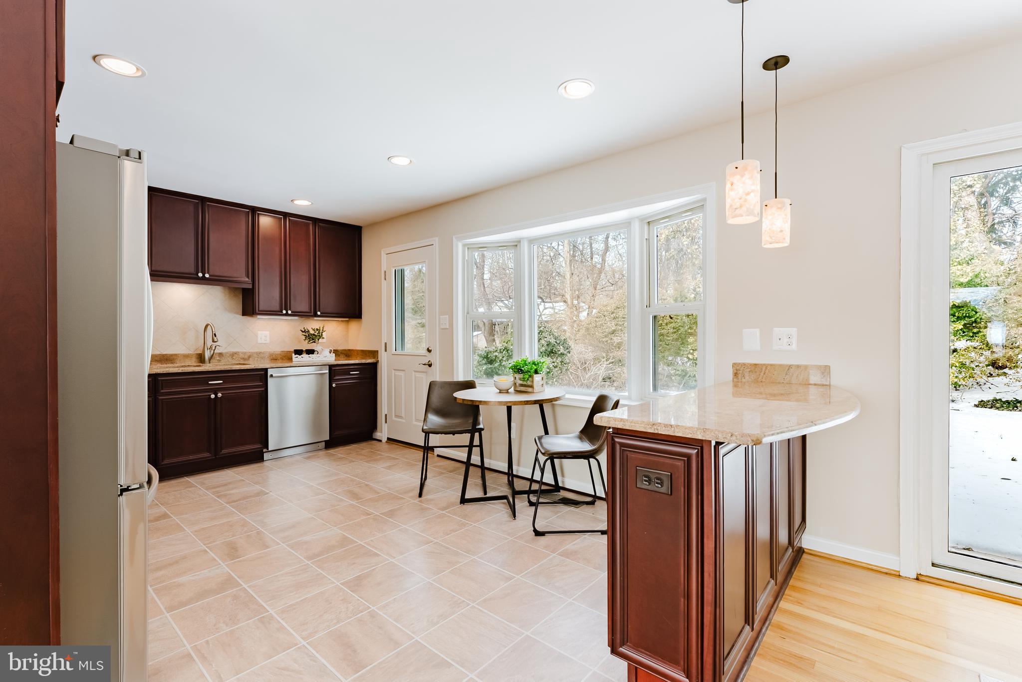4704 Federal Court Annandale, VA 22003 - Photo 14 of 51 a kitchen with kitchen island a large counter top space appliances and a window