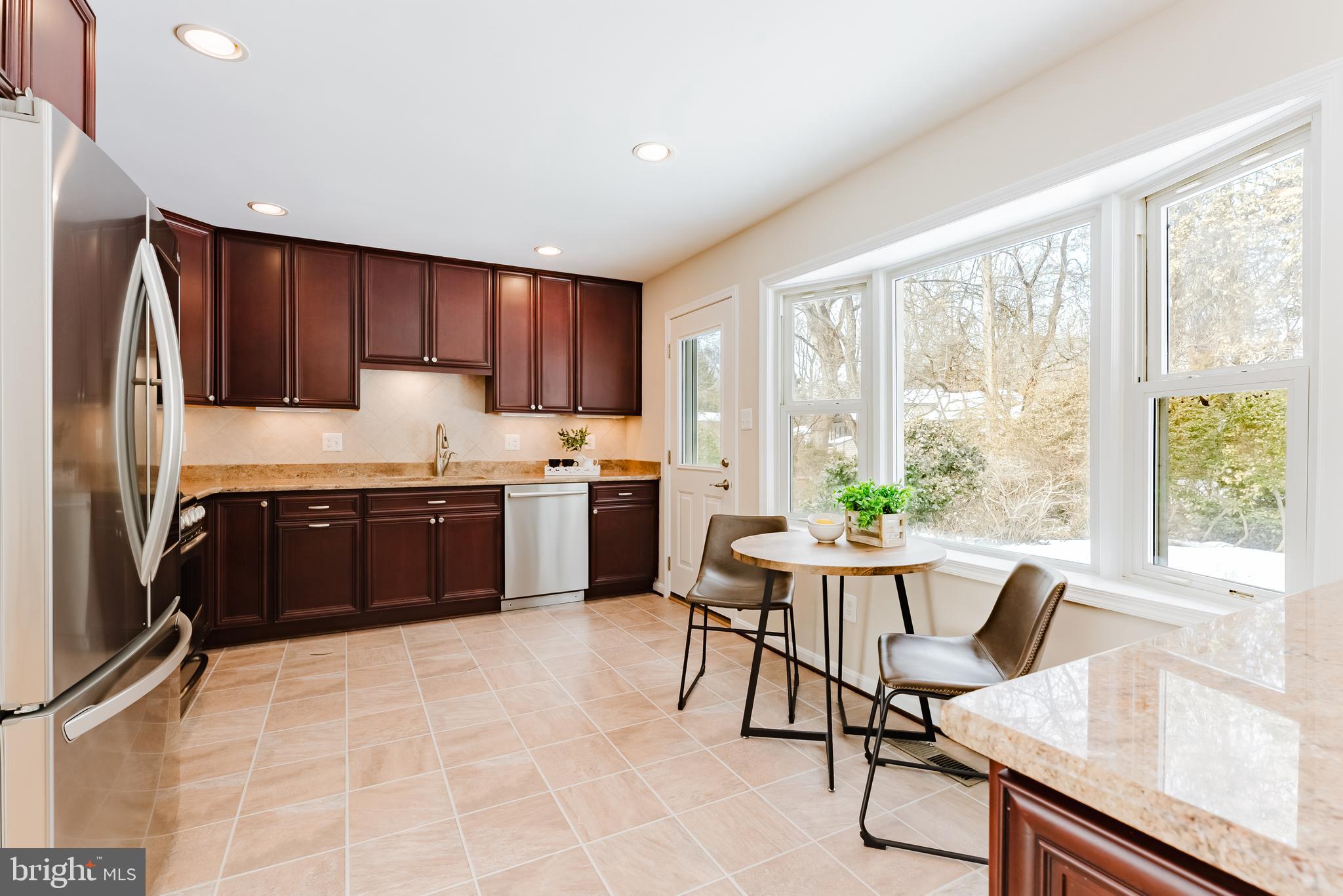 4704 Federal Court Annandale, VA 22003 - Photo 16 of 51 a kitchen with a table chairs sink and refrigerator