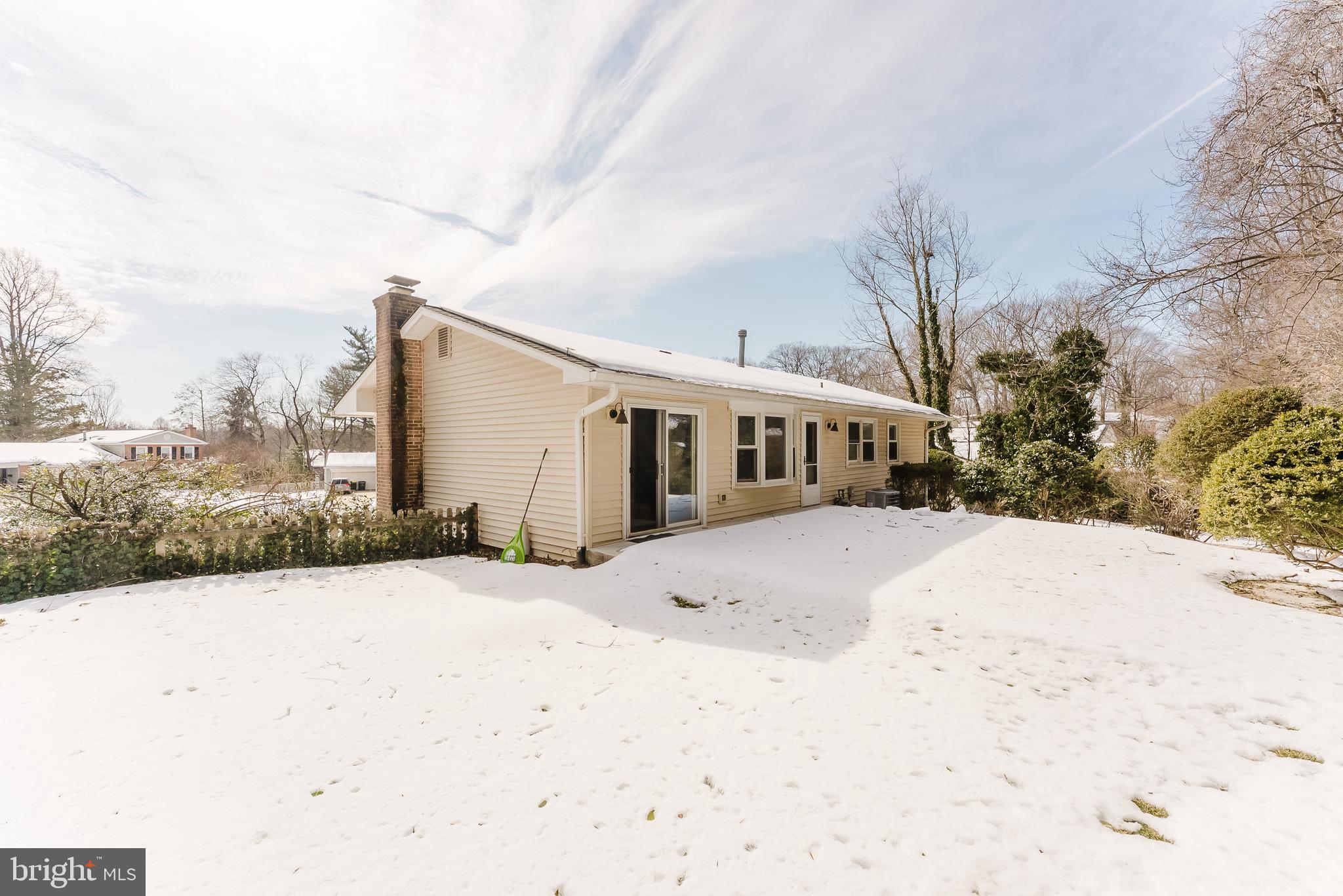 4704 Federal Court Annandale, VA 22003 - Photo 21 of 51 a front view of a house with a yard covered in snow