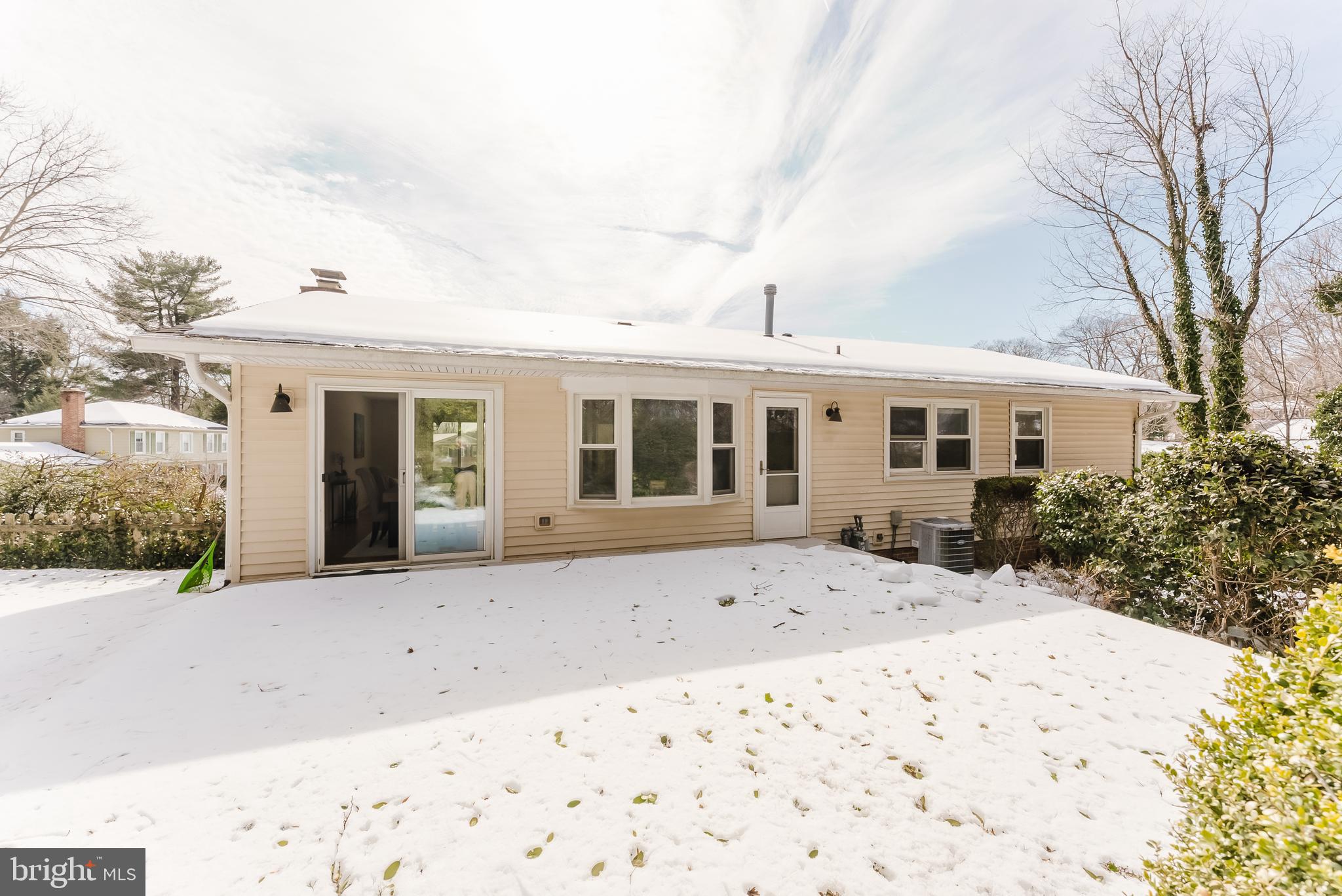 4704 Federal Court Annandale, VA 22003 - Photo 23 of 51 front view of a house with a wooden bench