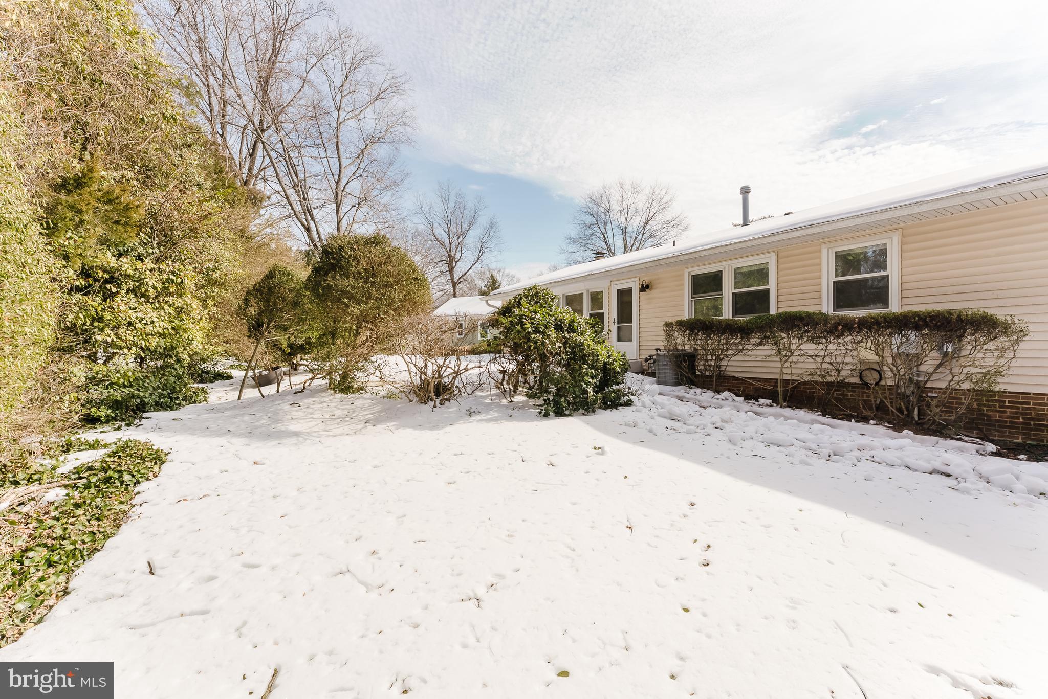 4704 Federal Court Annandale, VA 22003 - Photo 24 of 51 a front view of a house with a yard covered in snow