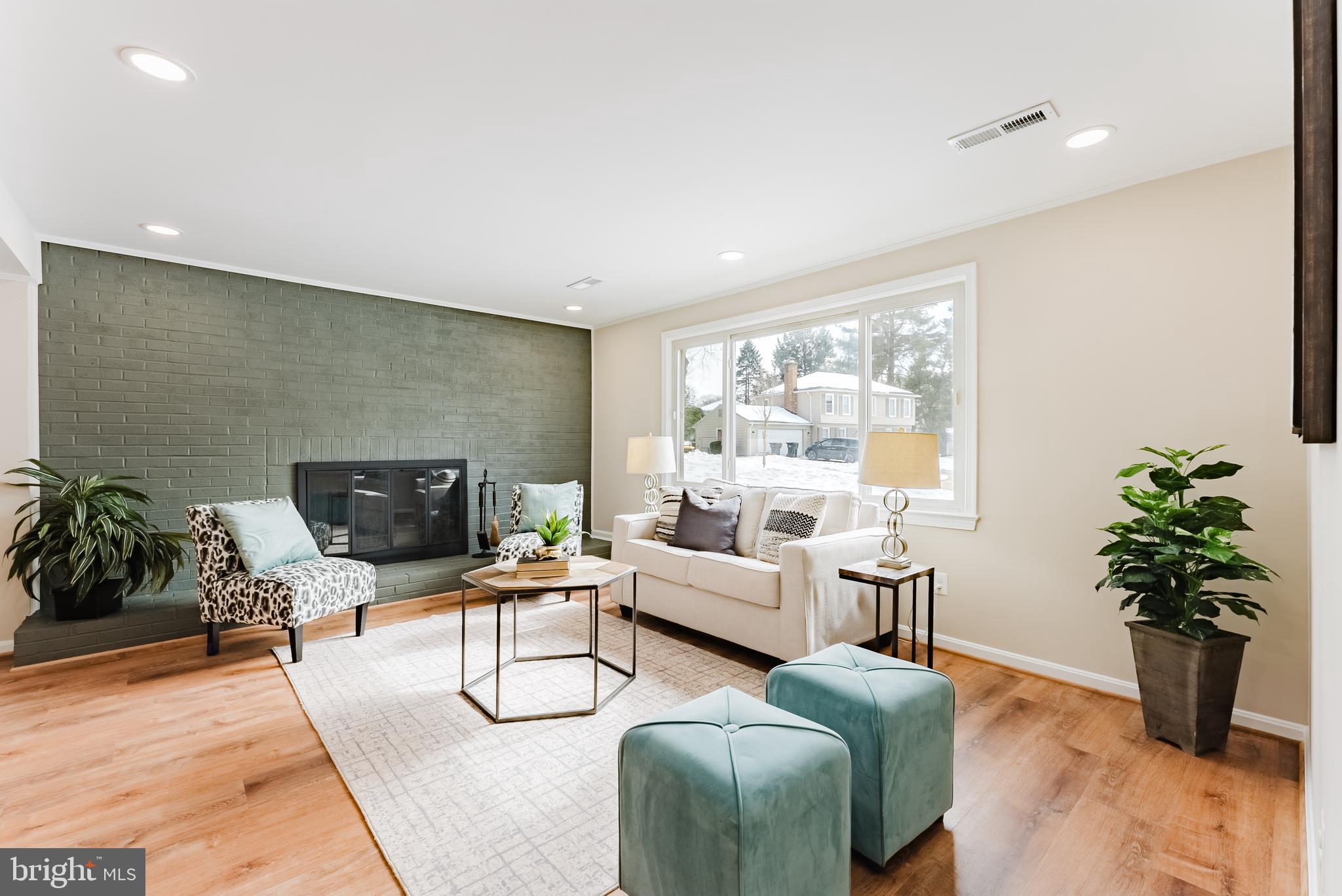 4704 Federal Court Annandale, VA 22003 - Photo 3 of 51 a living room with furniture potted plant and a fireplace