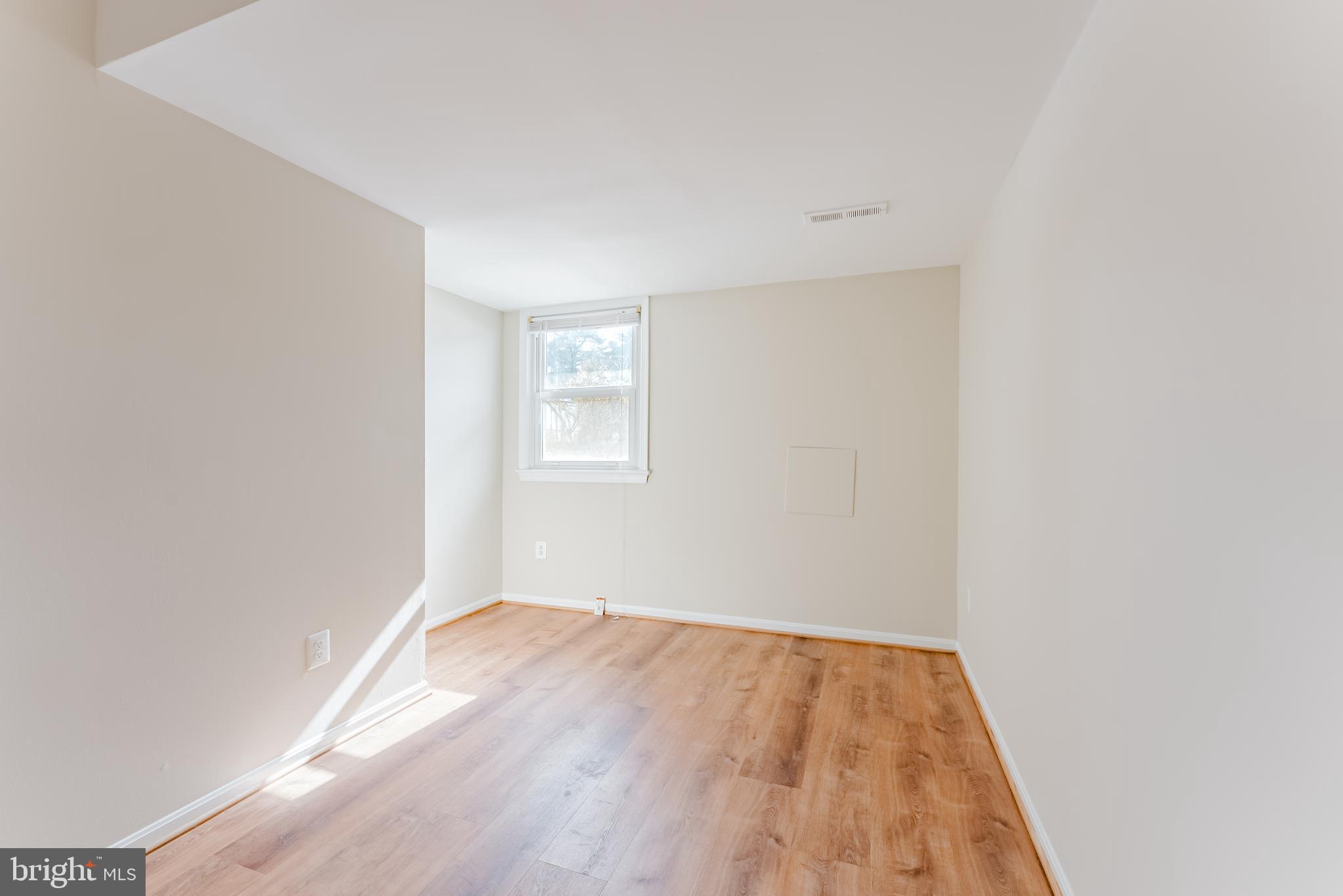 4704 Federal Court Annandale, VA 22003 - Photo 38 of 51 an empty room with wooden floor and windows