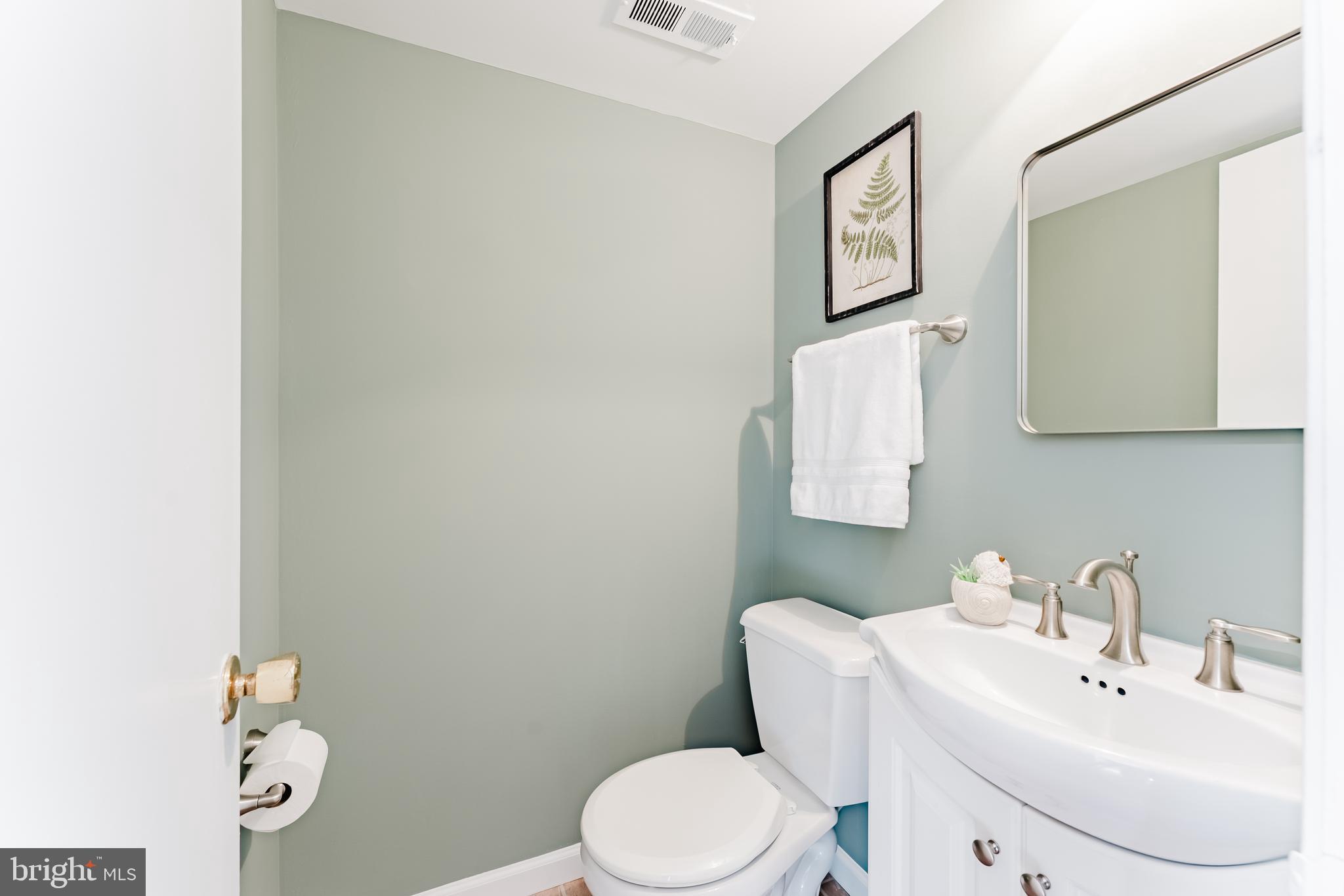 4704 Federal Court Annandale, VA 22003 - Photo 40 of 51 a bathroom with a sink mirror and toilet