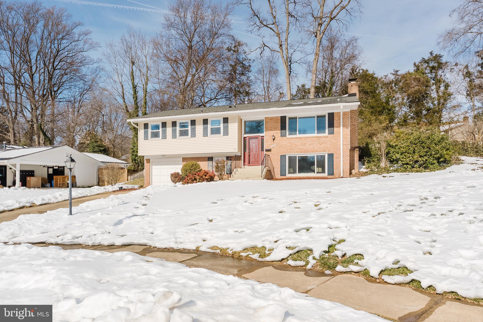 4704 Federal Court Annandale, VA 22003 - Photo 44 of 51 a front view of a house with a yard covered in snow