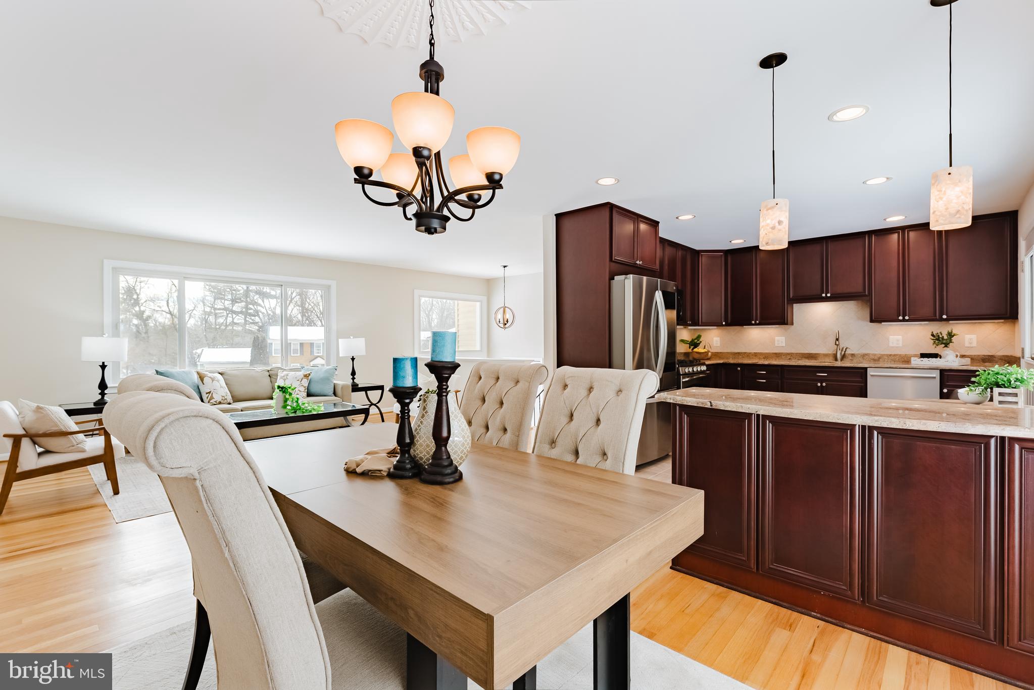 4704 Federal Court Annandale, VA 22003 - Photo 5 of 51 a kitchen with a dining table chairs and chandelier