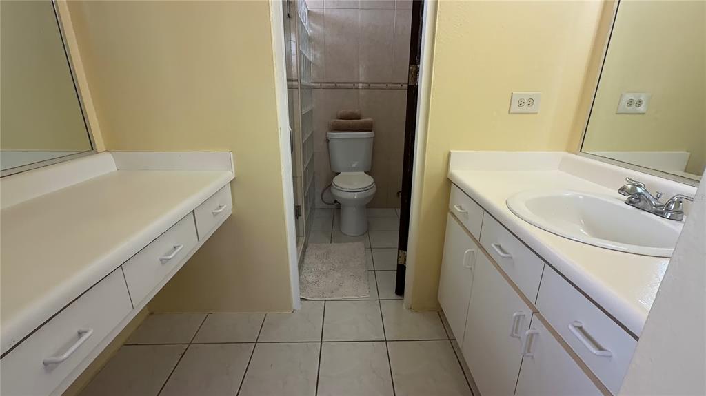 1 St Rio Grande, Unit B6 Rio Grande, PR 00745 - Photo 47 of 47 a bathroom with a sink a toilet and a mirror