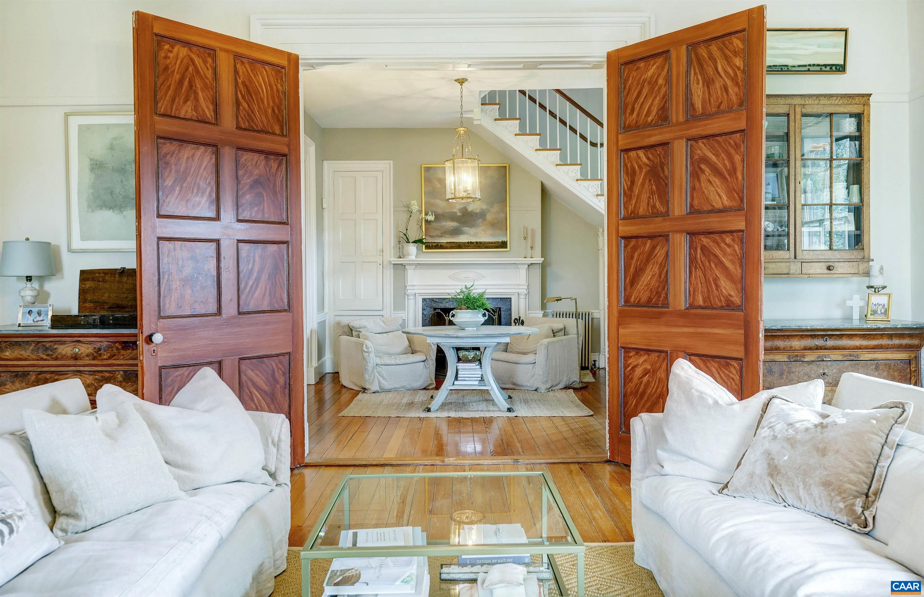 4710 Dickerson Road Earlysville, VA 22936 - Photo 12 of 75 a living room with furniture a rug and a painting on the wall