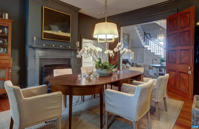 a dining room with furniture and wooden floor
