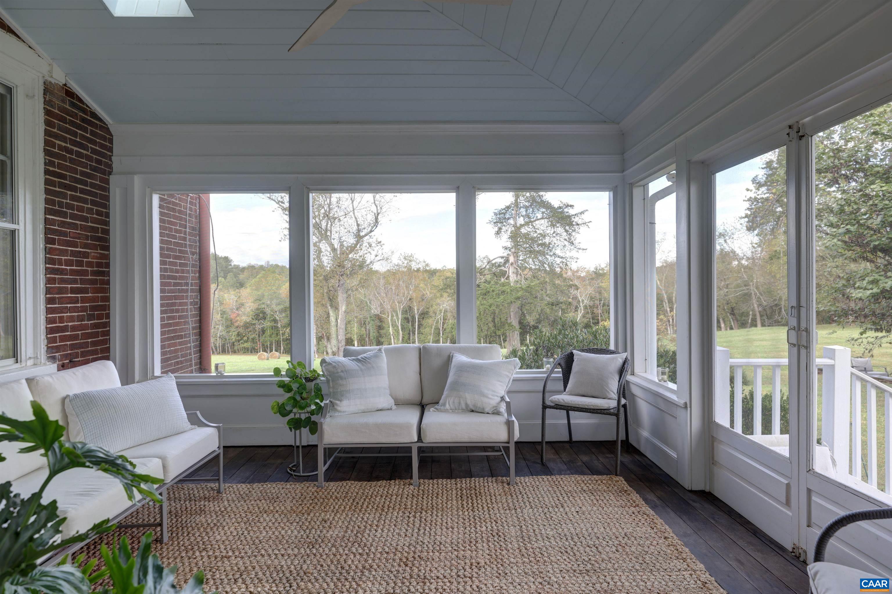 4710 Dickerson Road Earlysville, VA 22936 - Photo 24 of 75 a living room with furniture and a large window