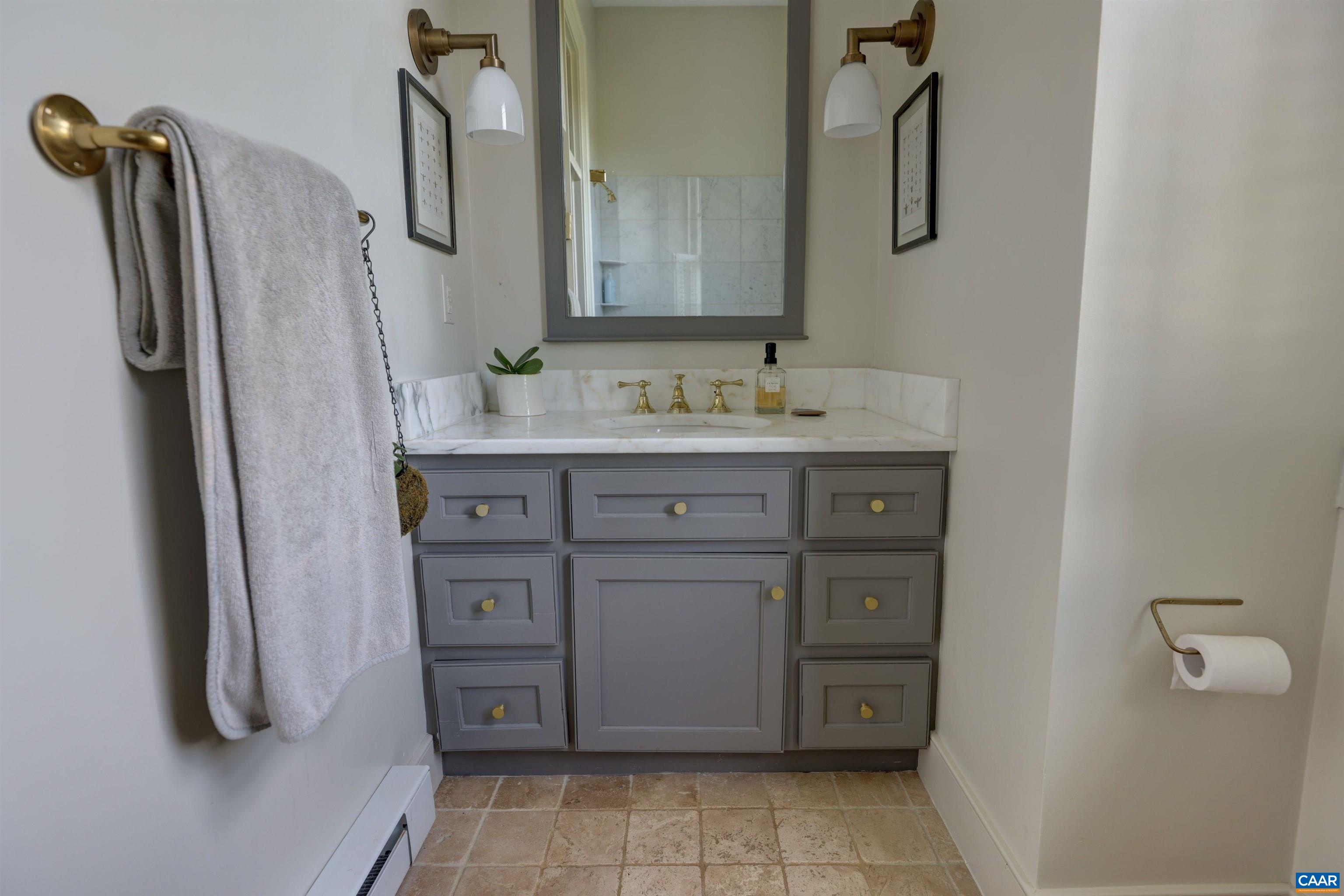 4710 Dickerson Road Earlysville, VA 22936 - Photo 28 of 75 a bathroom with a granite countertop sink a vanity and a mirror