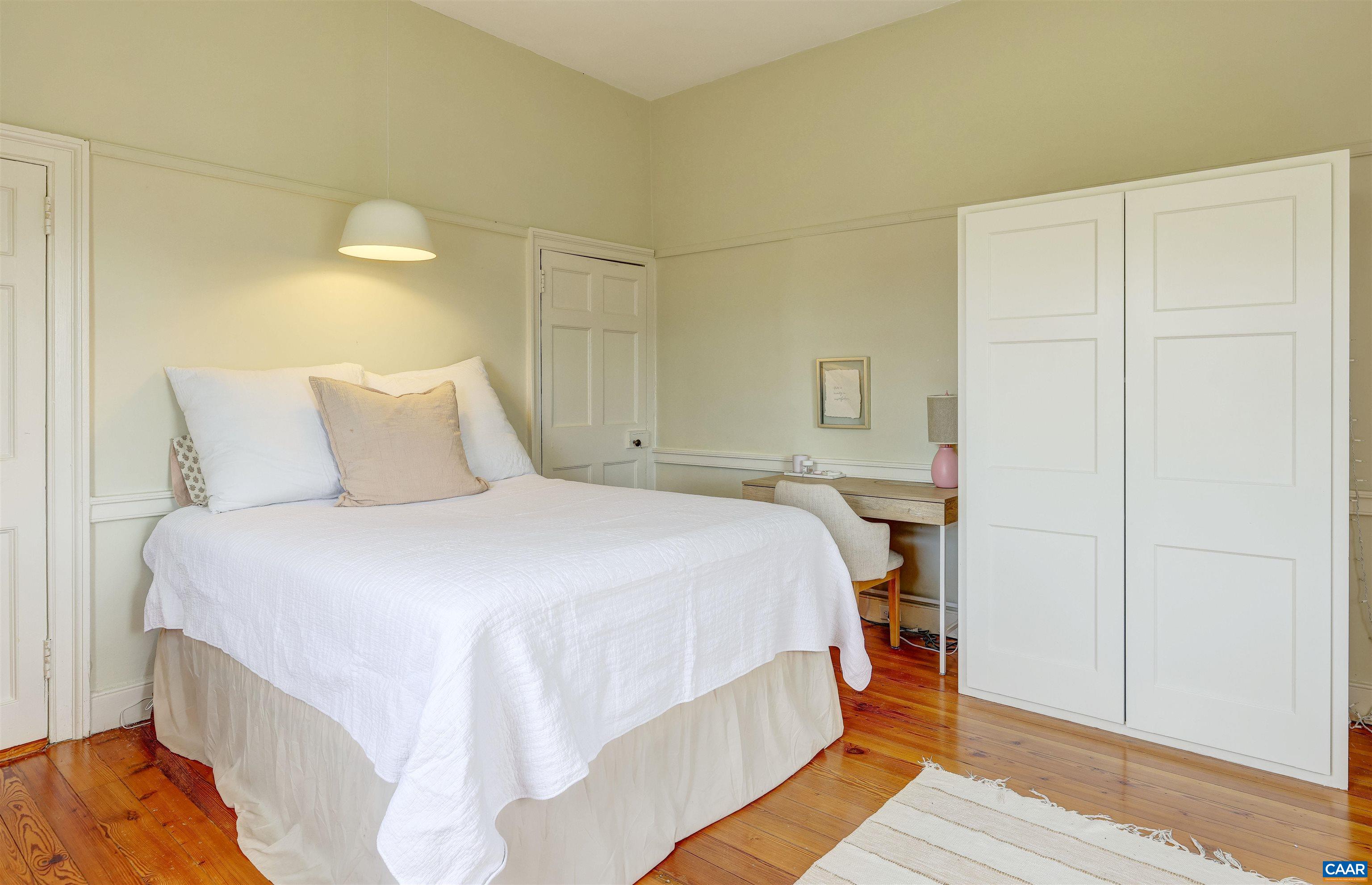 4710 Dickerson Road Earlysville, VA 22936 - Photo 38 of 75 a bedroom with a bed and wooden floor