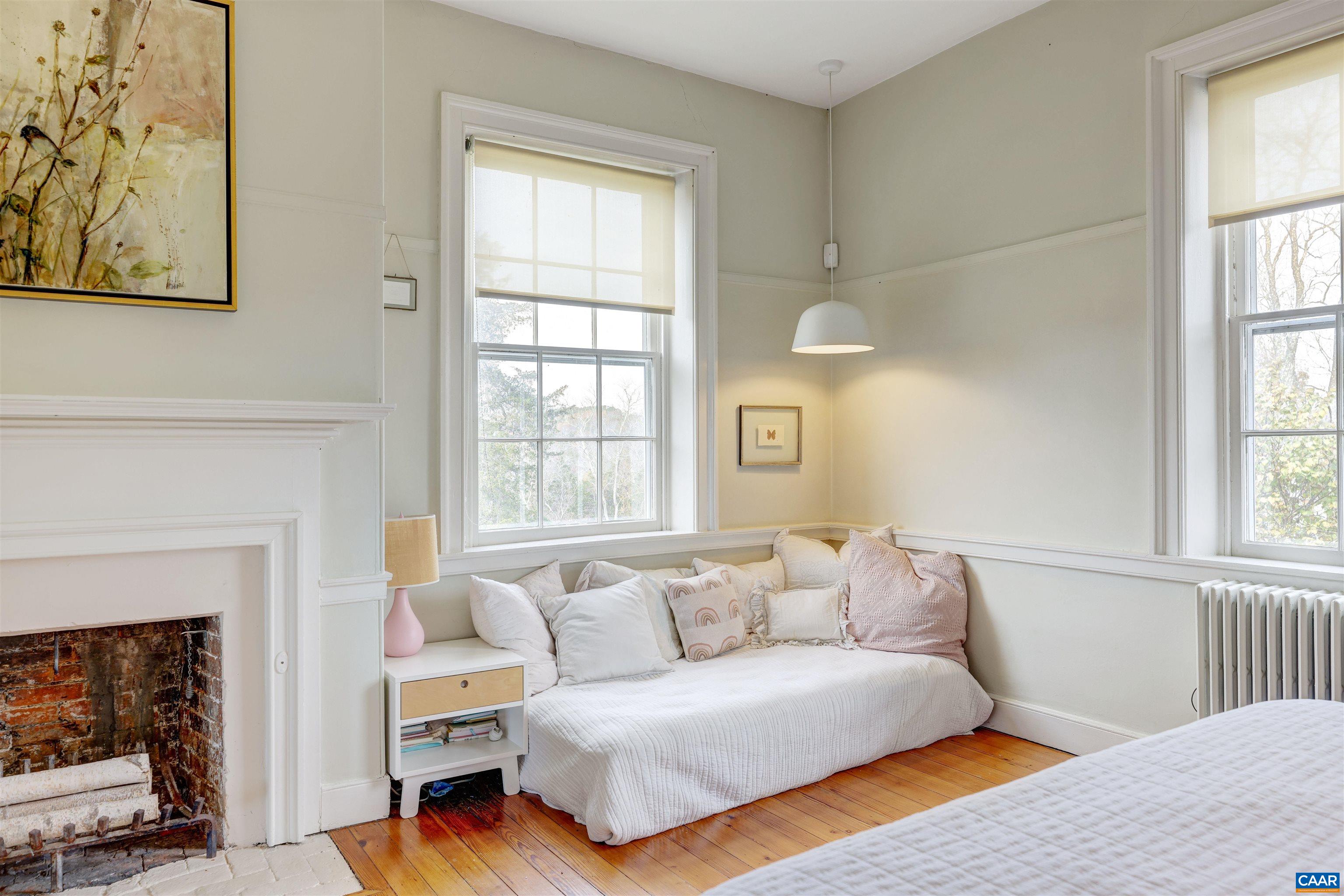 4710 Dickerson Road Earlysville, VA 22936 - Photo 39 of 75 a living room with furniture and a fireplace