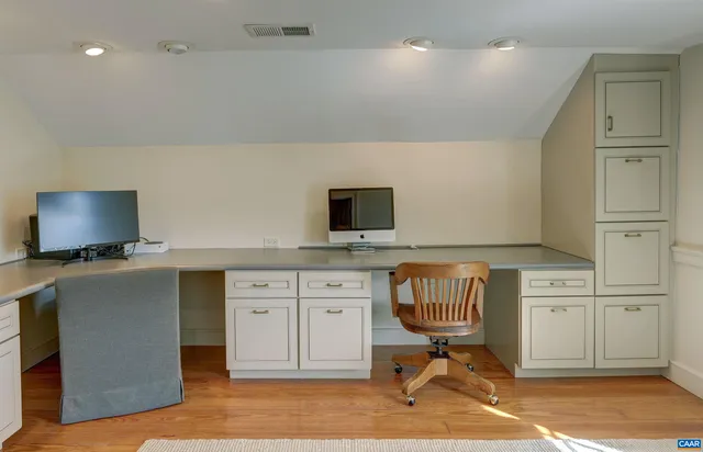 a view of a grassy field with trees