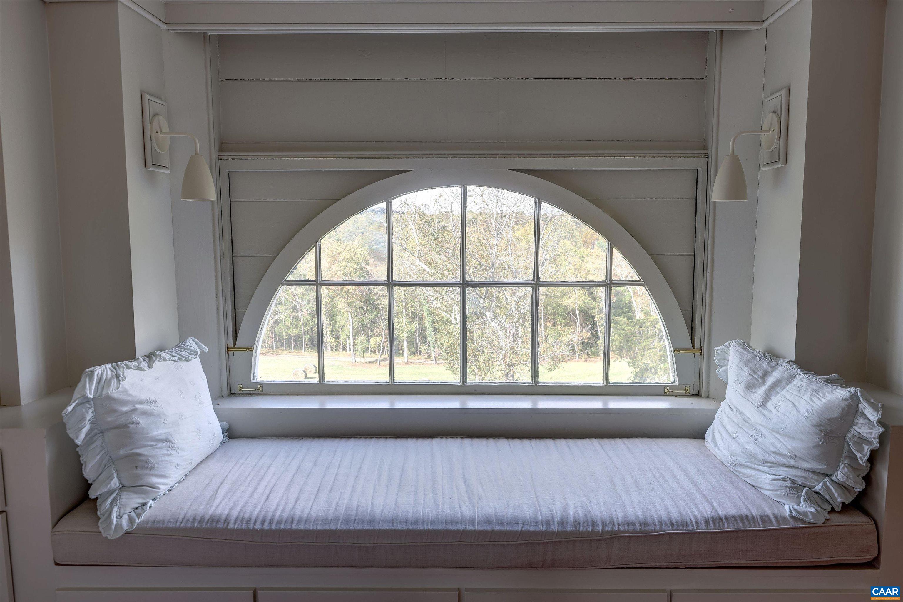 4710 Dickerson Road Earlysville, VA 22936 - Photo 46 of 75 a living room with a large window couches and kitchen view