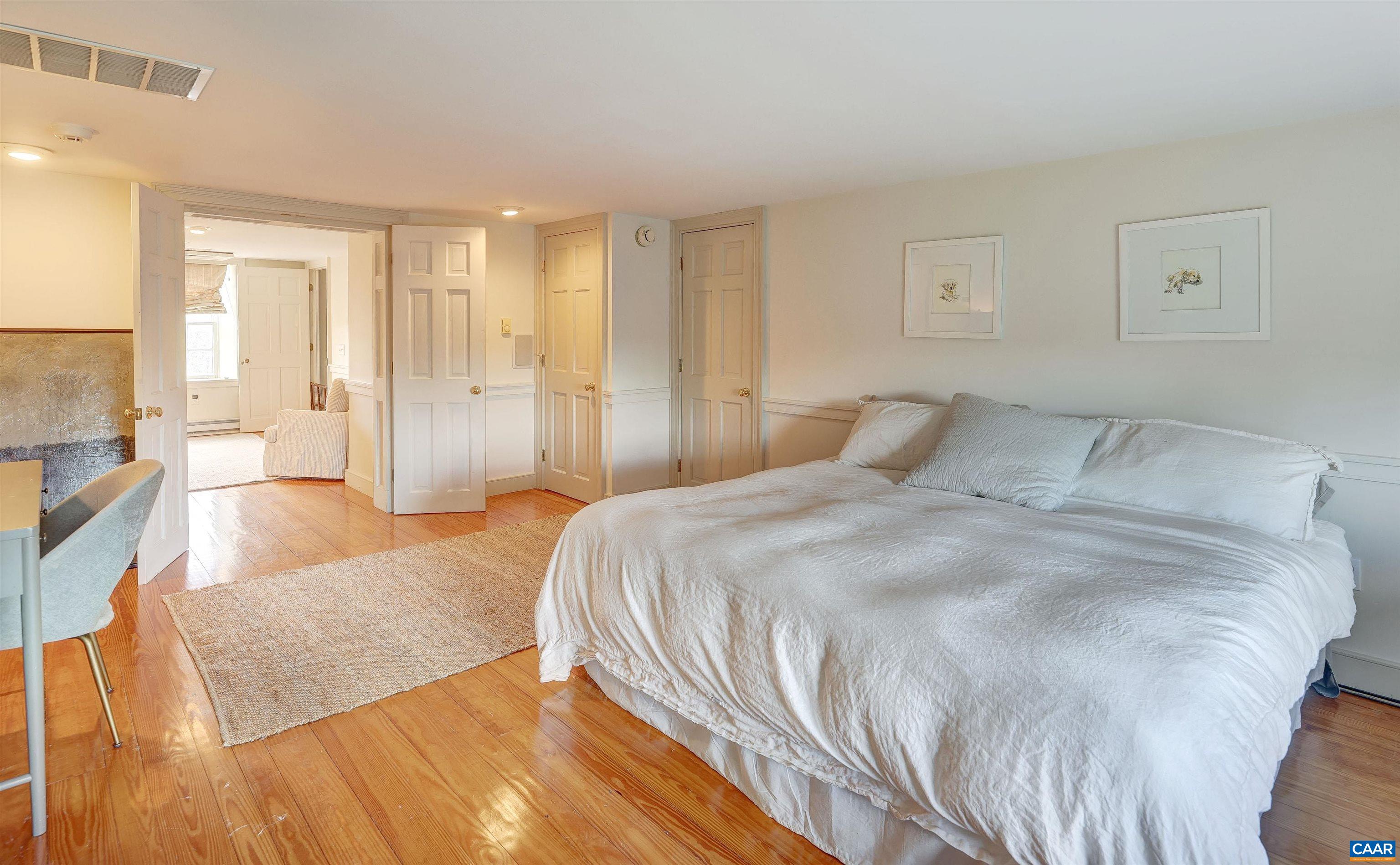 4710 Dickerson Road Earlysville, VA 22936 - Photo 47 of 75 a spacious bedroom with a bed and a couch