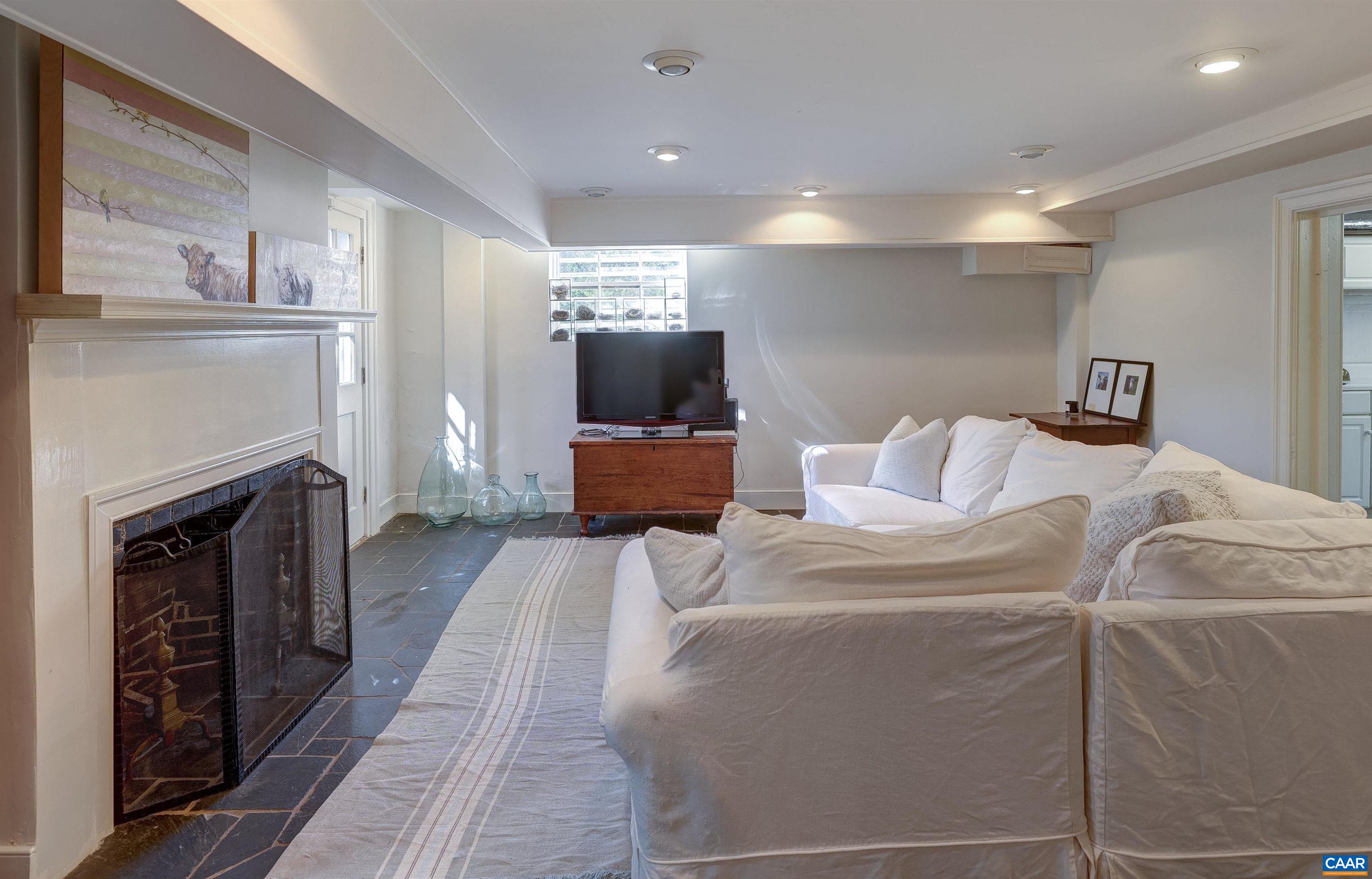 4710 Dickerson Road Earlysville, VA 22936 - Photo 49 of 75 a bed room with a bed and a television