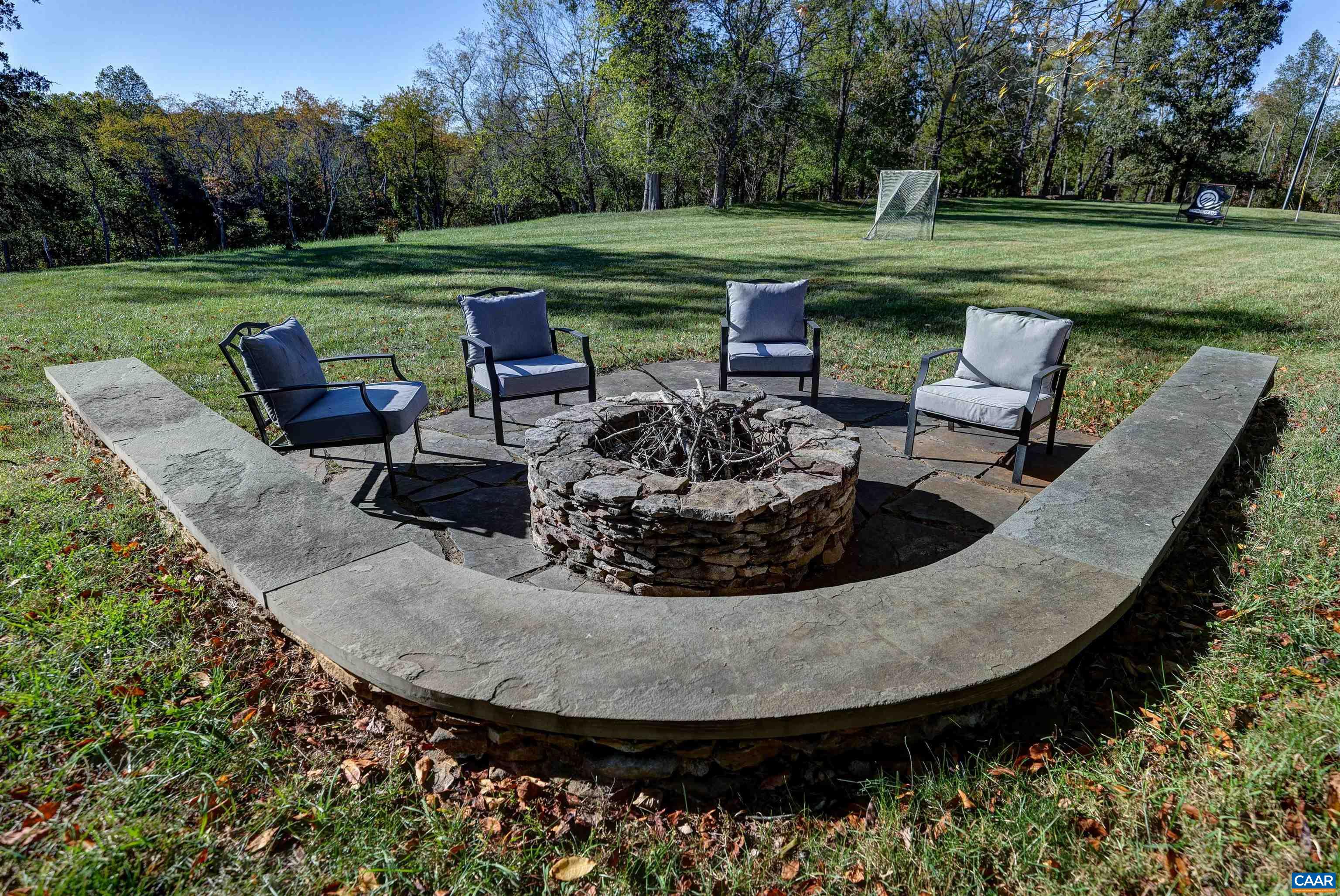 4710 Dickerson Road Earlysville, VA 22936 - Photo 57 of 75 a view of a swimming pool with a patio and a garden