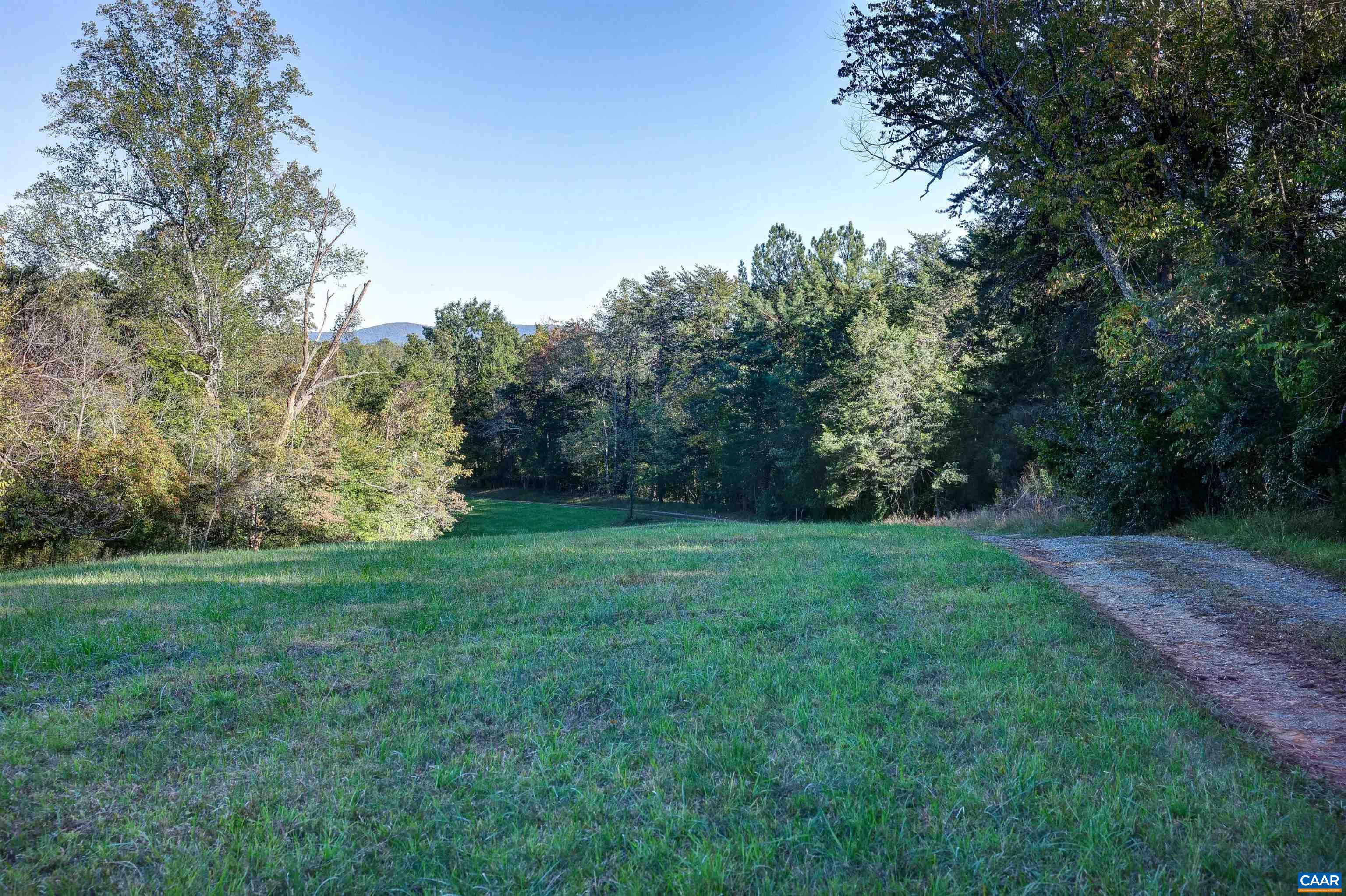 4710 Dickerson Road Earlysville, VA 22936 - Photo 68 of 75 a view of a grassy field with trees