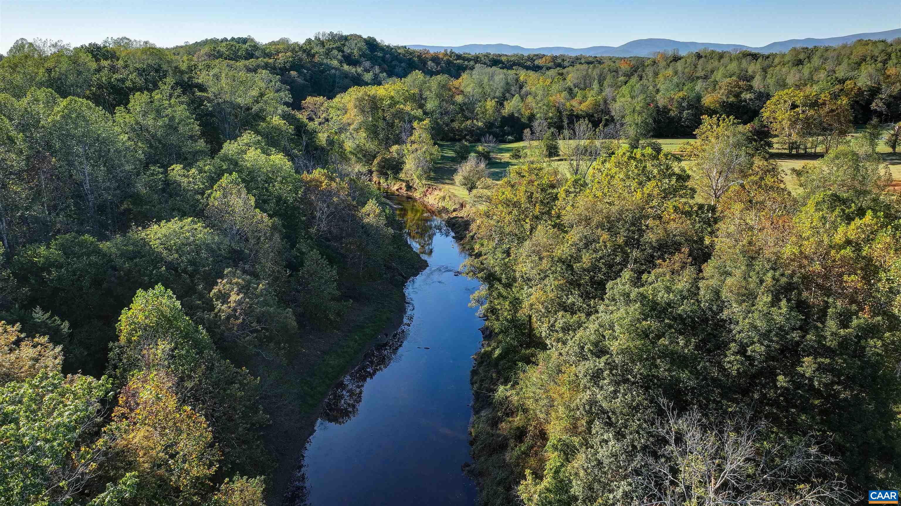 4710 Dickerson Road Earlysville, VA 22936 - Photo 73 of 75 a view of a lake with mountain