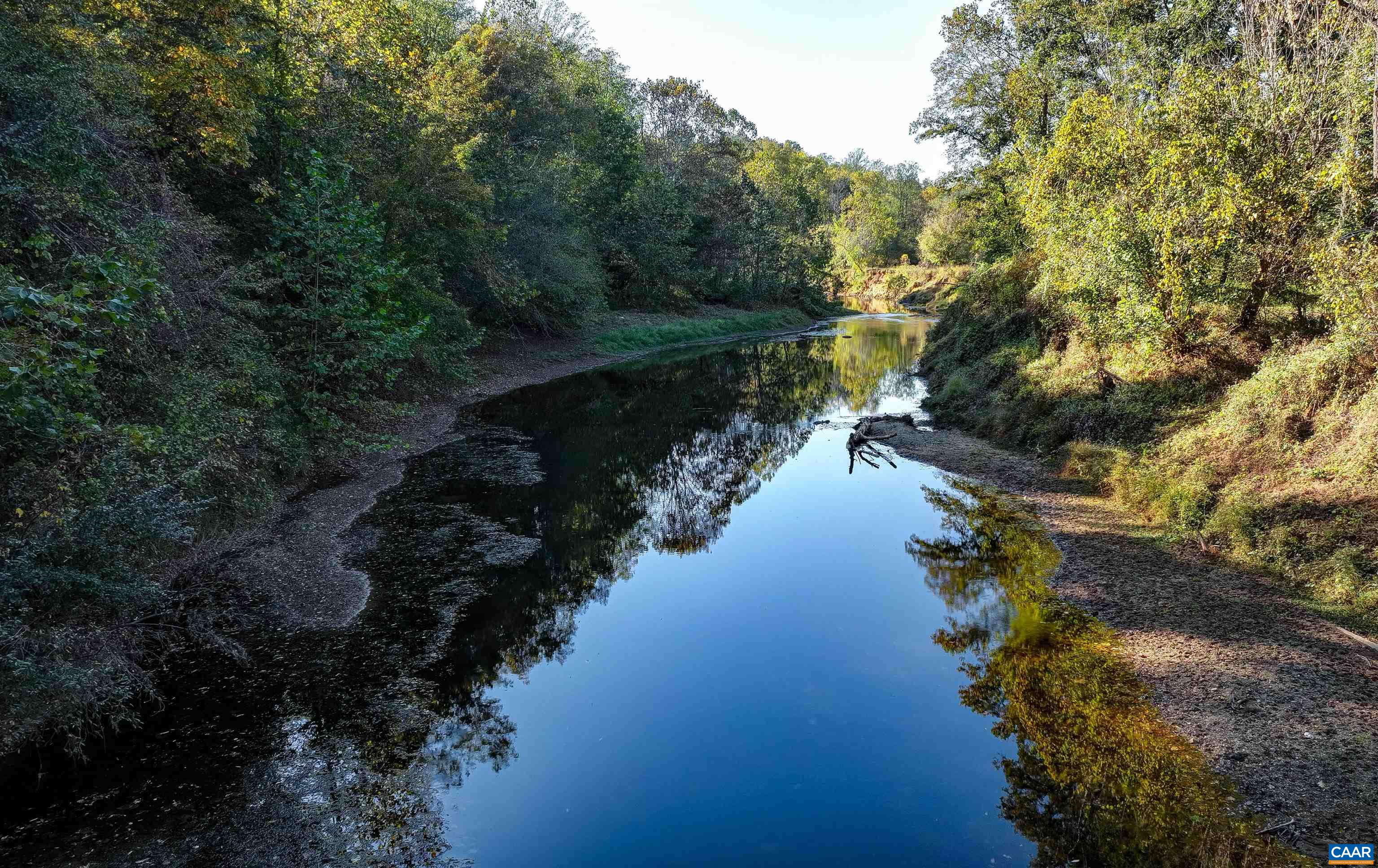 4710 Dickerson Road Earlysville, VA 22936 - Photo 74 of 75 a view of a lake in middle of forest