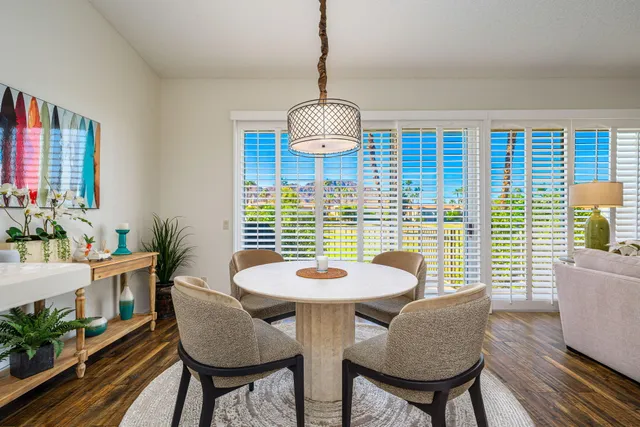 a view of a dining room with furniture window and wooden floor