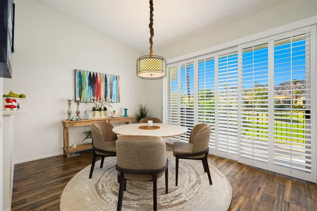a bathroom with a sink a mirror a toilet and shower