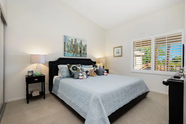 a bedroom with a bed and a couch