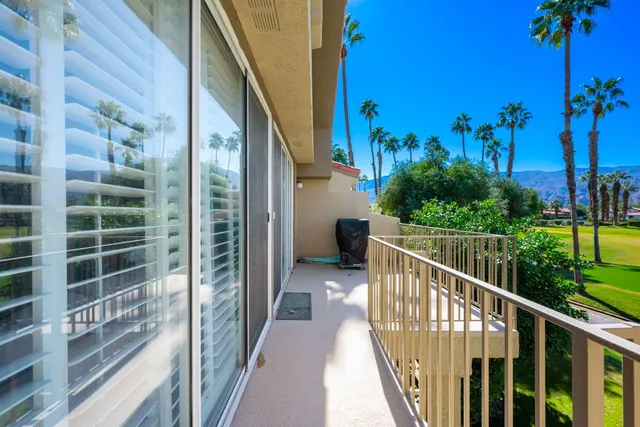 a view of a lake with a house in the background