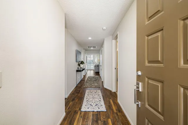 a living room with furniture and a lamp