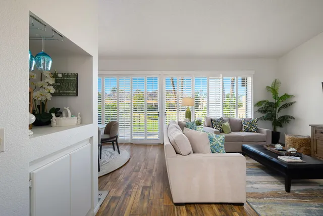 a kitchen with stainless steel appliances granite countertop a refrigerator and a stove