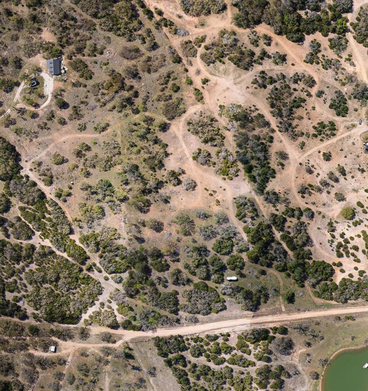 402 County Road 402 Goldthwaite, TX 76844 - Photo 26 of 40 a view of a dry yard with lots of trees