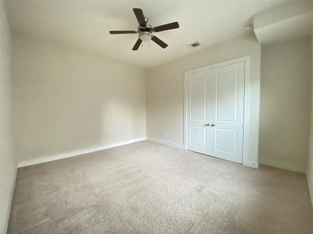 a spacious bathroom with a tub a sink and a mirror