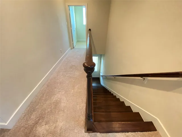 a view of a house with a small yard and a large window