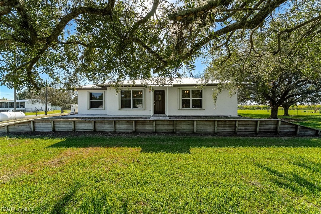 1140 Sealey Road Moore Haven, FL 33471 - Photo 1 of 29 a view of a house with a big yard