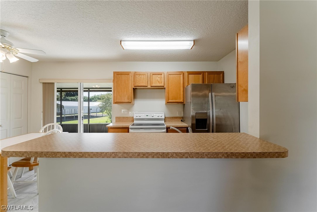 1140 Sealey Road Moore Haven, FL 33471 - Photo 12 of 29 a bathroom with a granite countertop sink and a mirror