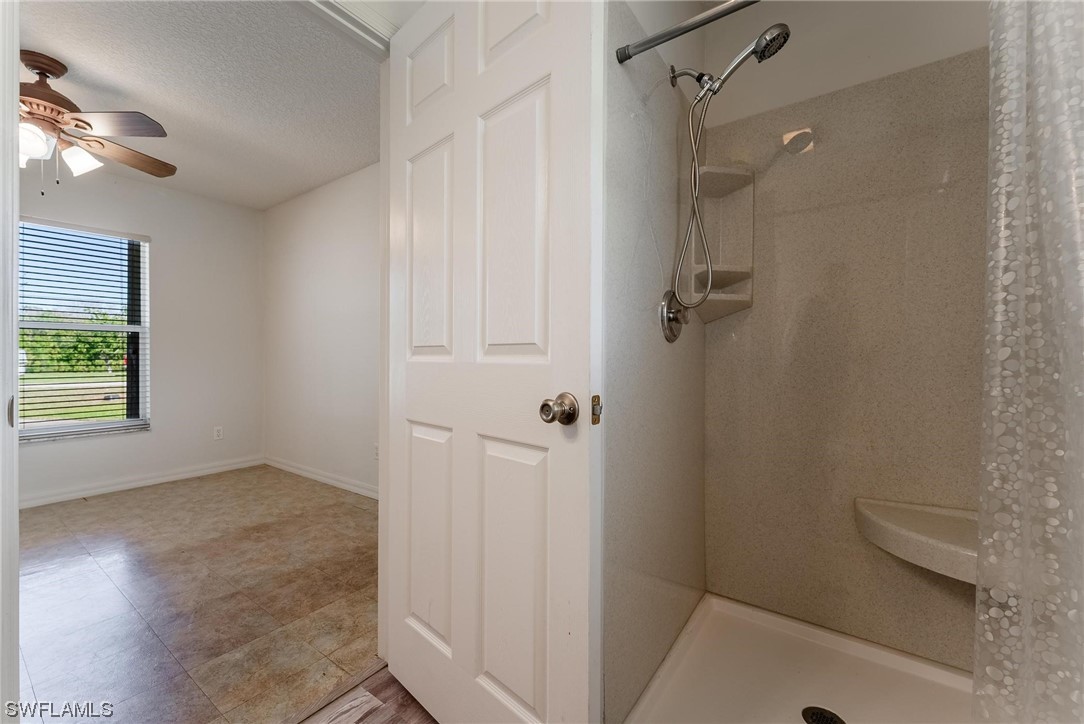 1140 Sealey Road Moore Haven, FL 33471 - Photo 16 of 29 a bathroom with a shower and a toilet