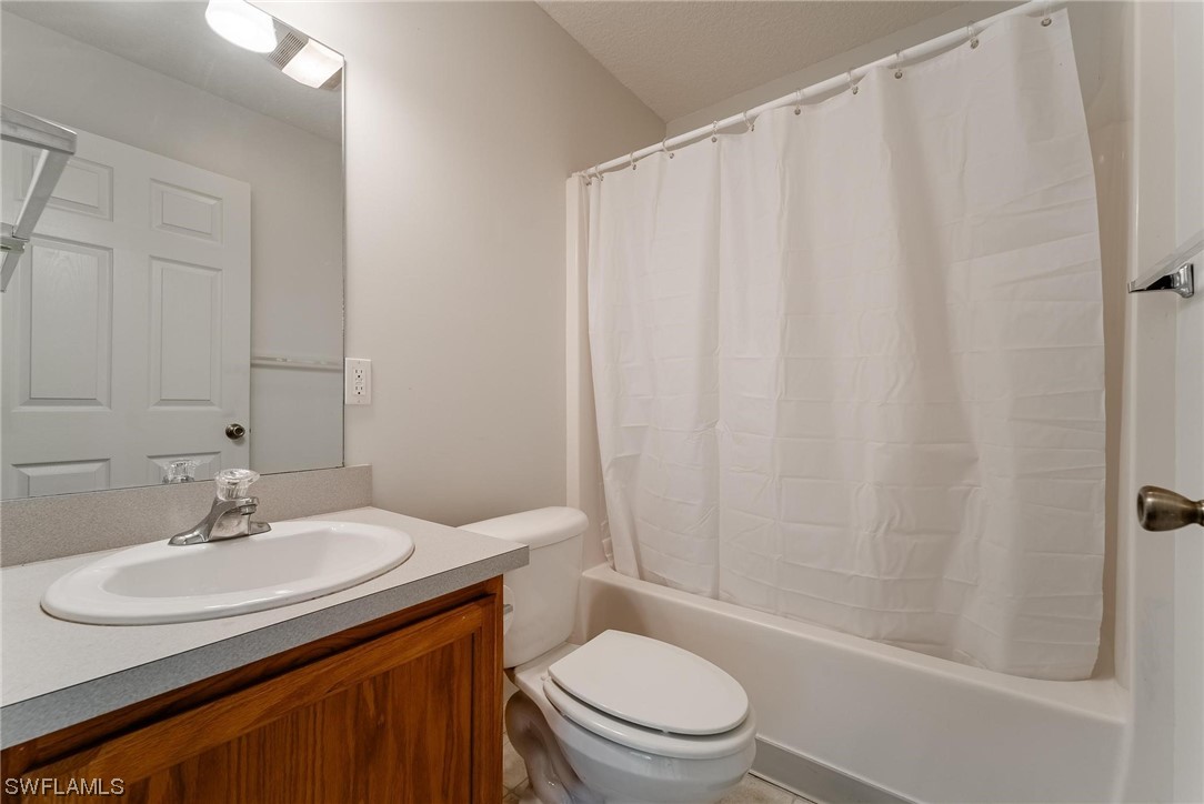 1140 Sealey Road Moore Haven, FL 33471 - Photo 19 of 29 a bathroom with a sink toilet and shower
