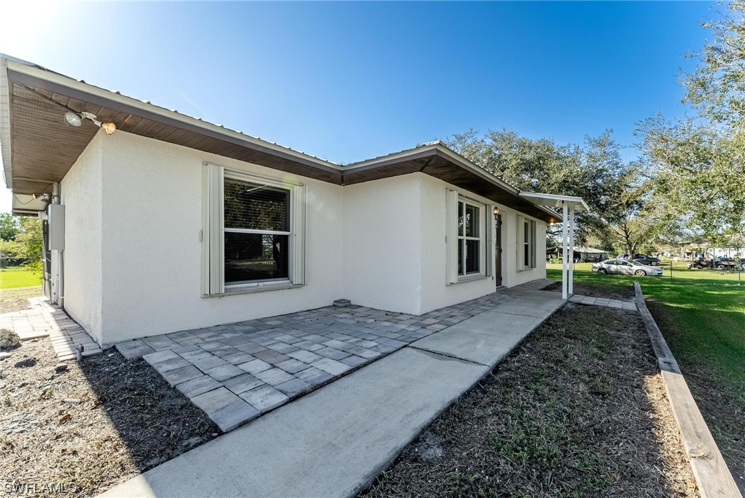 1140 Sealey Road Moore Haven, FL 33471 - Photo 2 of 29 a view of a house with a yard