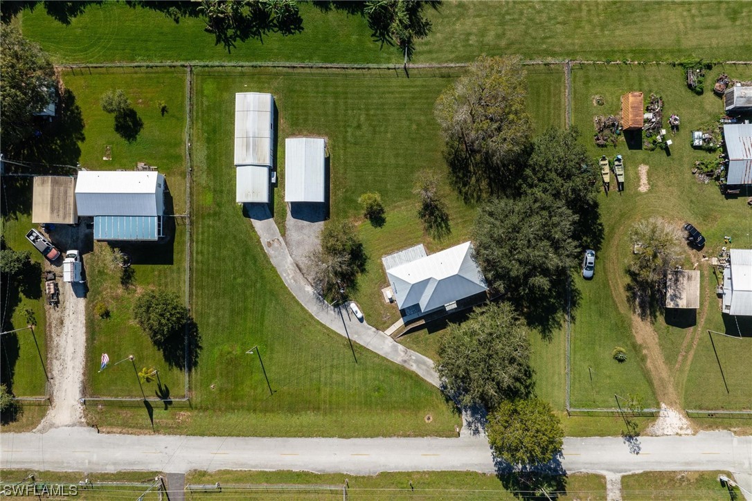 1140 Sealey Road Moore Haven, FL 33471 - Photo 29 of 29 an aerial view of a house with a garden