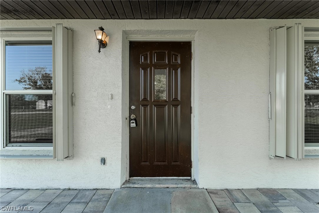 1140 Sealey Road Moore Haven, FL 33471 - Photo 6 of 29 a view of entryway front of house
