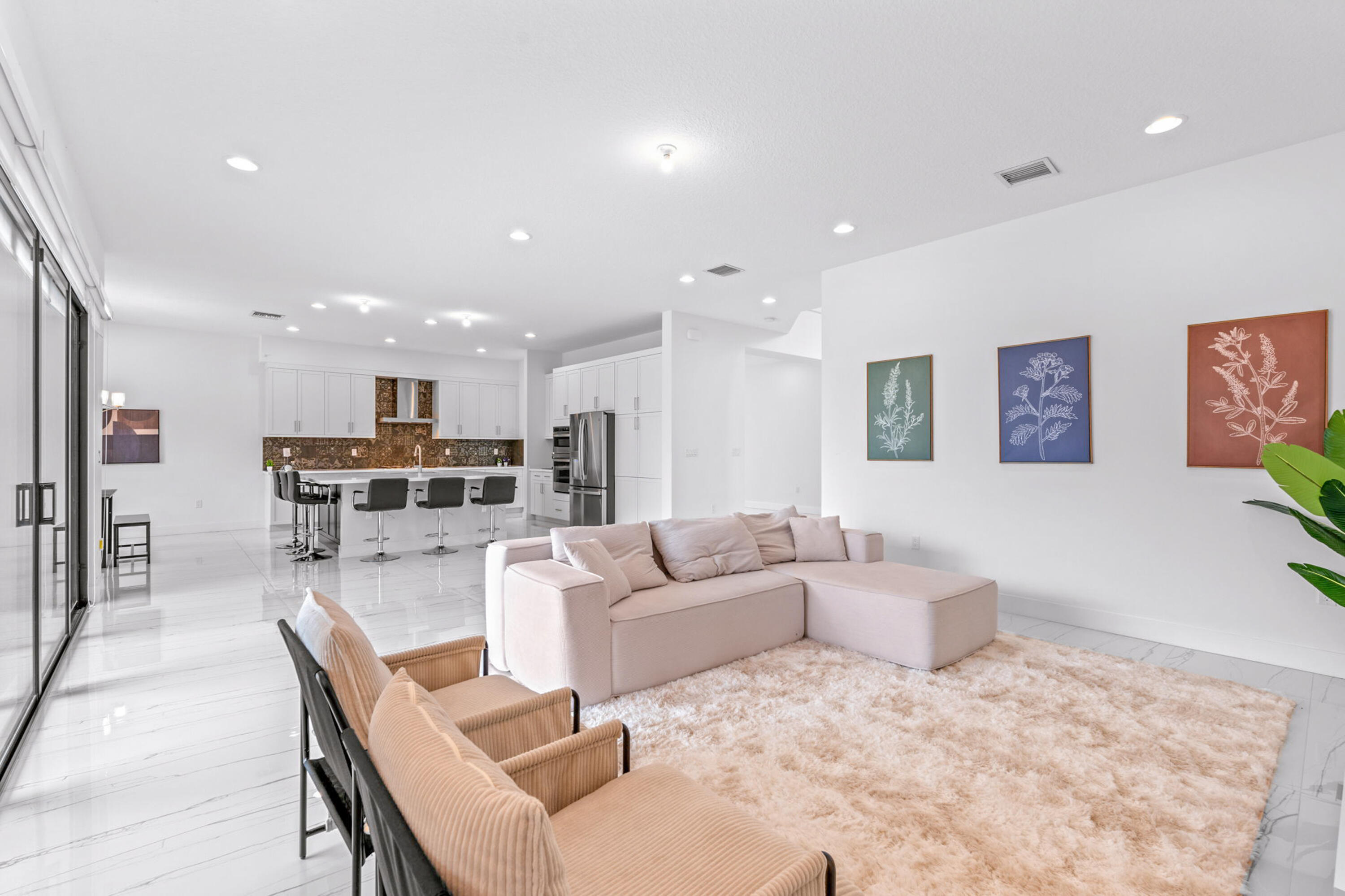 17117 Teton River Road Boca Raton, FL 33496 - Photo 20 of 67 a living room with furniture and kitchen view