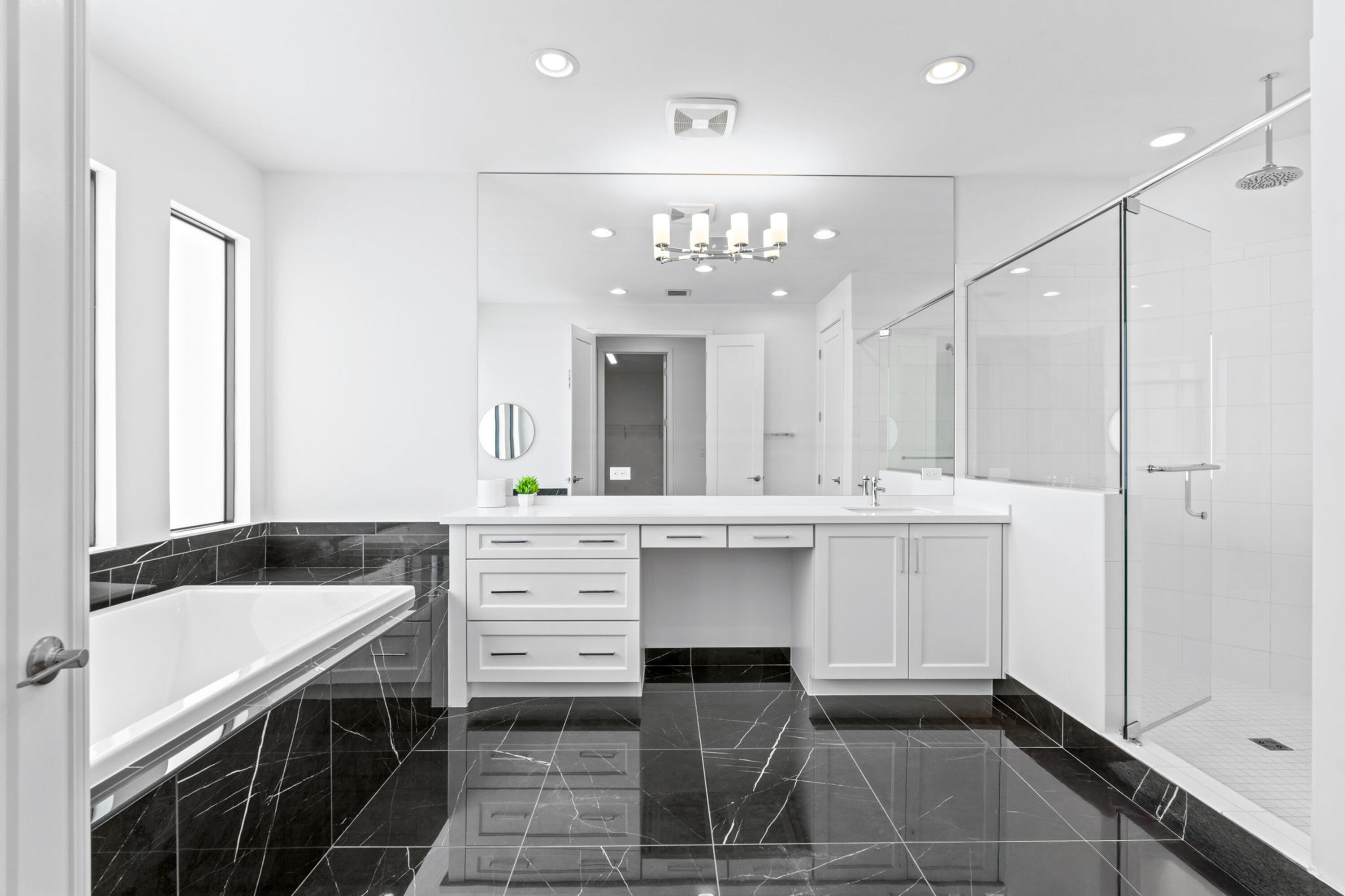 17117 Teton River Road Boca Raton, FL 33496 - Photo 28 of 67 a bathroom with a sink vanity granite tub shower and a mirror