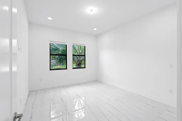 a bathroom with a toilet a sink and a mirror