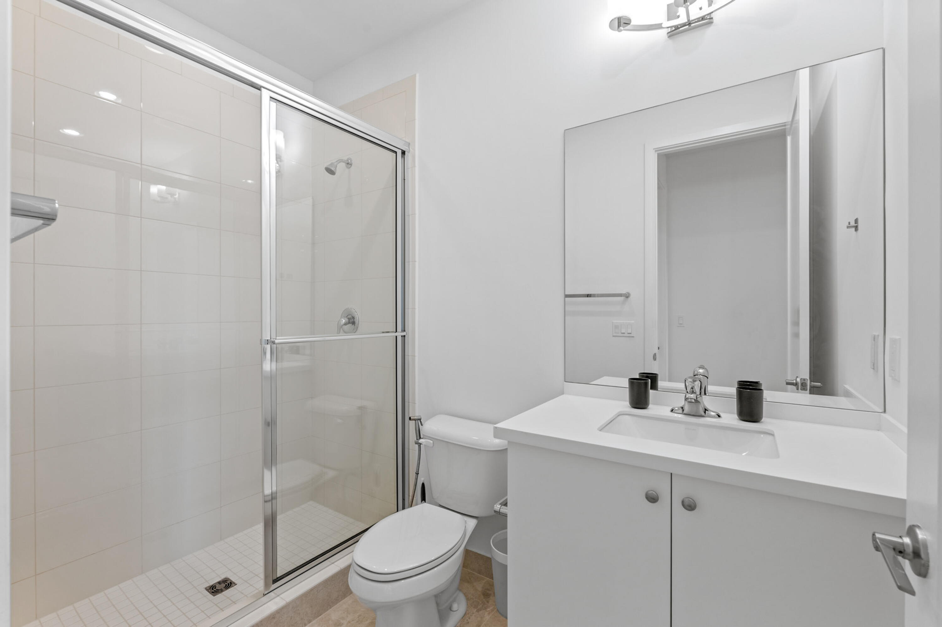 17117 Teton River Road Boca Raton, FL 33496 - Photo 32 of 67 a bathroom with a sink a toilet and shower