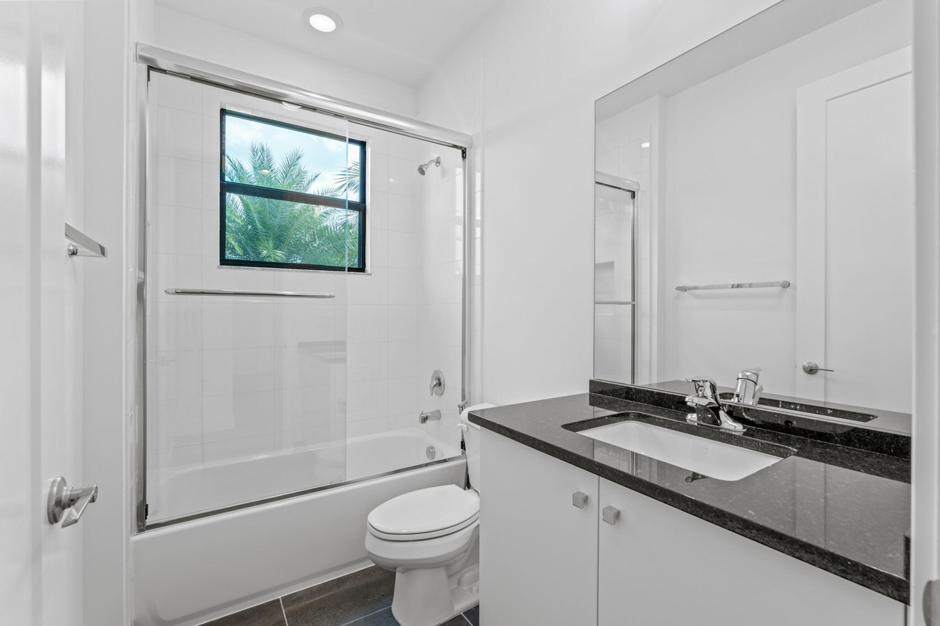 17117 Teton River Road Boca Raton, FL 33496 - Photo 33 of 67 a bathroom with a sink and a mirror