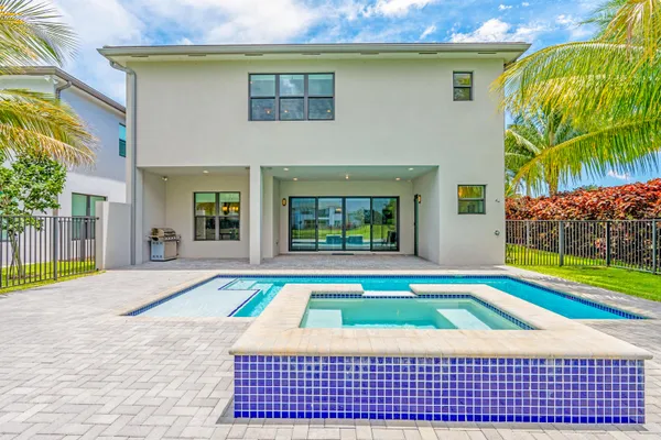 a view of a swimming pool with a outdoor seating