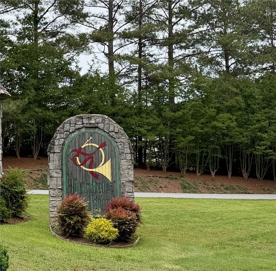 232 Hunters Trail Walhalla, SC 29691 - Photo 36 of 38 Welcome to Hunters Run, a charming community sign set against a backdrop of lush greenery.